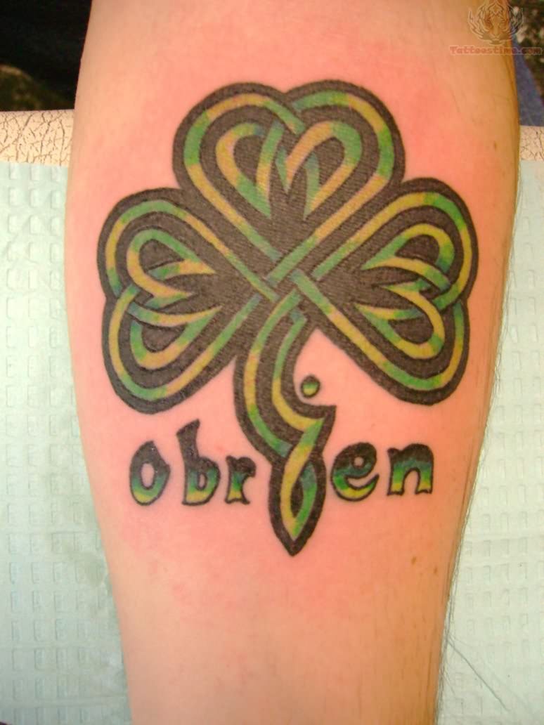 Amazing Celtic Shamrock Black And Green Ink Leaf Tattoo On Back Leg