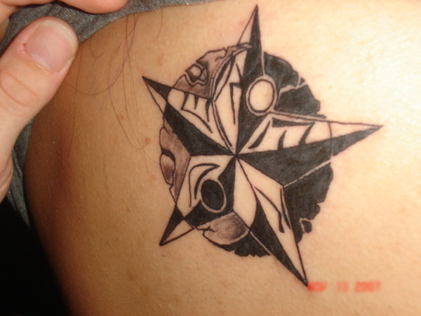 Amazing Grey And Black Nautical Star Tattoo On Back
