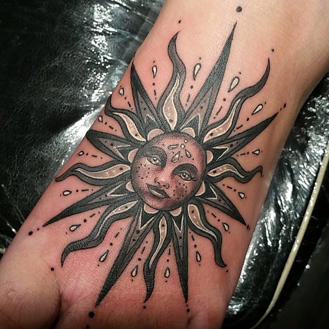 Amazing Sun Tattoo On Left Foot