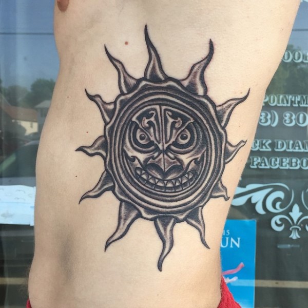 Angry Sun Tattoo On Man Left Rib Side