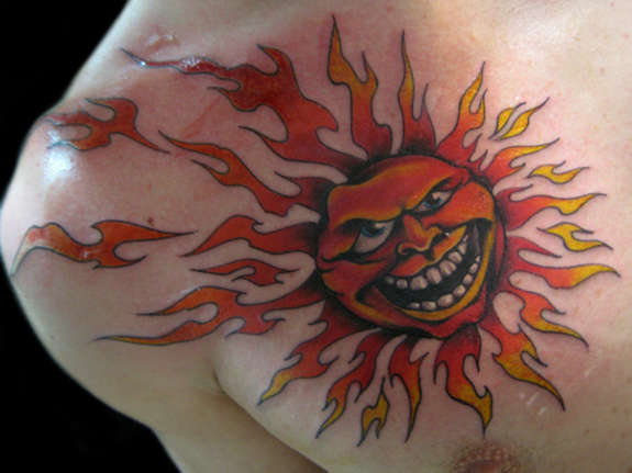 Angry Sun with Rays Tattoo On Front Shoulder