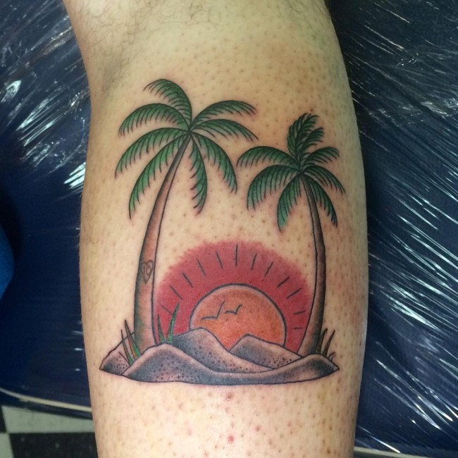 Back Leg Rising Sun Between Two Palm Tree Tattoos