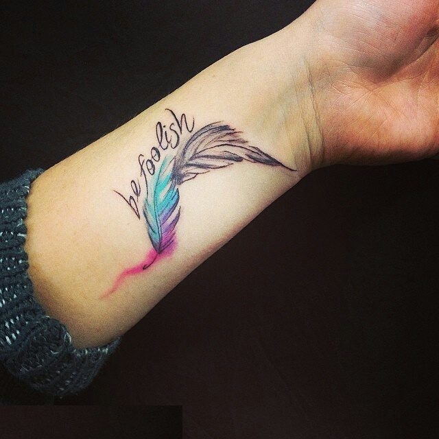 Be Foolish Colorful Feather Tattoo On Left Wrist