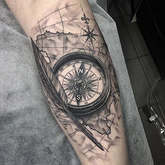 Beautiful Feather And Compass Tattoo On Back Leg