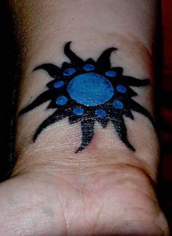 Black And Blue Ink Simple Sun Tattoo On Wrist