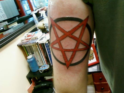 Black And Red Pentagram Star Tattoo On Bicep