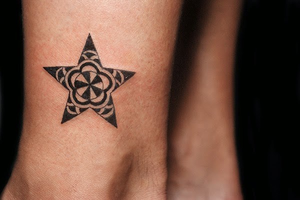 Black And White Star Tattoo On Left Leg