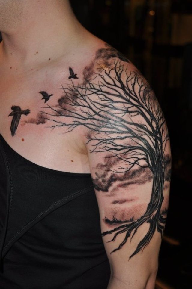 Black Ink Flying Birds And Autumn Tree Tattoo On Left Shoulder