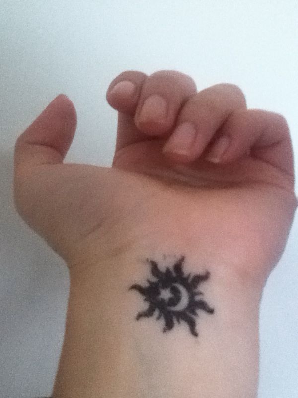 Black Moon With Star And Moon Tattoo On Left Wrist