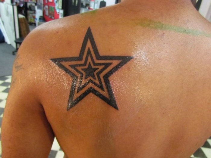 Black Outline Three Stars On One Tattoo On Left Back Shoulder