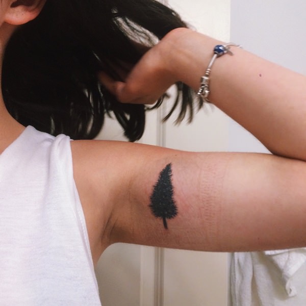 Black Pine Tree Tattoo On Girl Left Inner Bicep