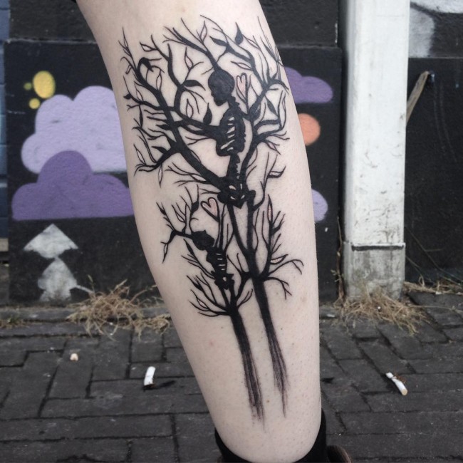 Black Skeleton With Tree Tattoo On Back Leg