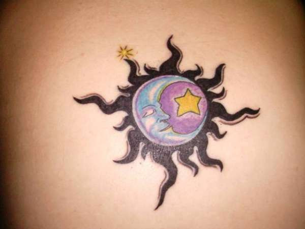 Black Tribal Sun With Moon And Star Tattoo