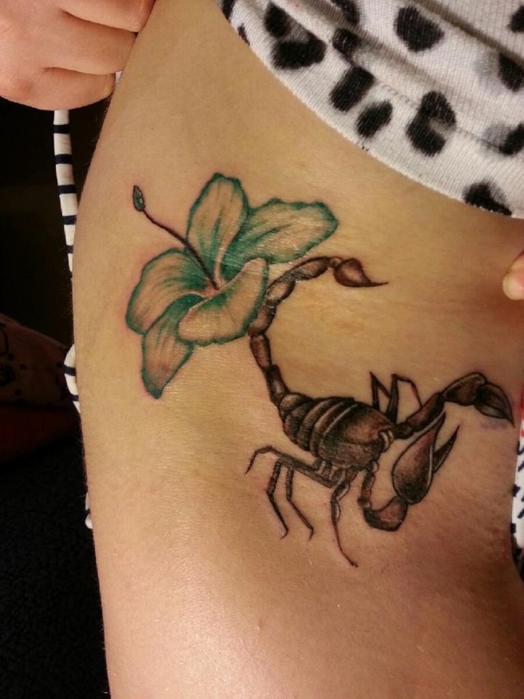 Blue Flower And Feminine Scorpion Tattoo On Side Rib
