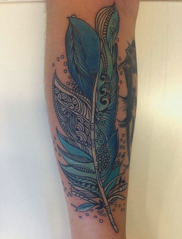 Blue Ink Feather Tattoo On Leg