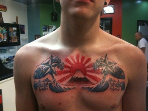 Blue Ink Water Waves With Nautical Star With Rising Sun Tattoo On Man Chest