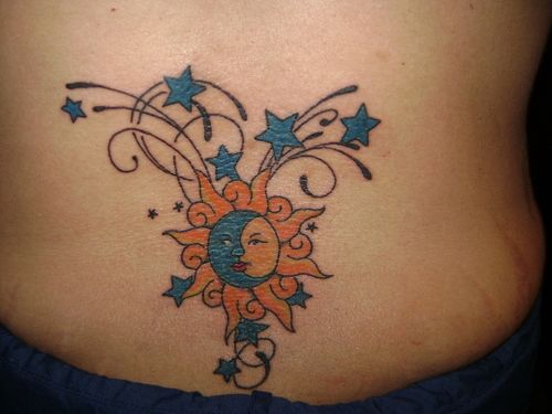 Blue Moons And Sun Tattoo On Lower Back