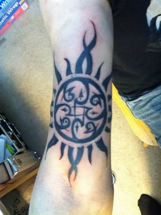 Celtic Sun Tattoo On Inner Bicep
