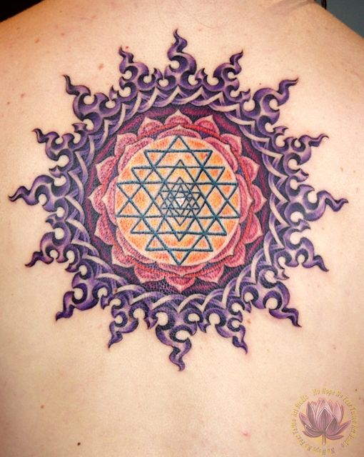 Celtic Sun Tattoo On Man Upper Back