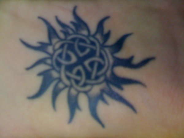 Celtic Sun With Black Tribal Rays Tattoo Idea