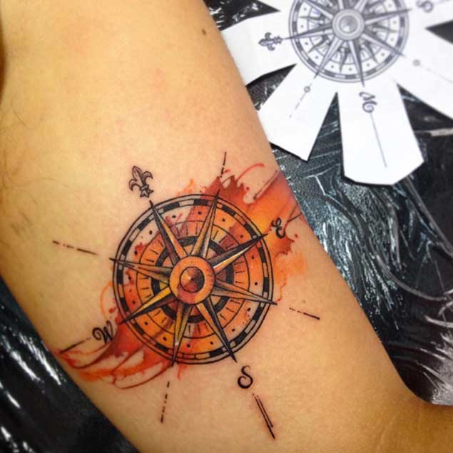 Colored Compass Tattoo On Bicep