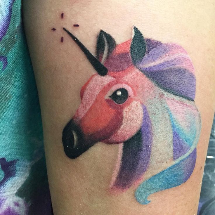 Colored Feminine Unicorn Tattoo On Girl Left Bicep