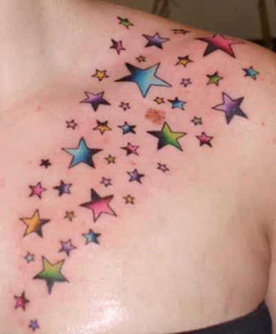 Colored Shooting Stars Tattoo On Girl Front Shoulder