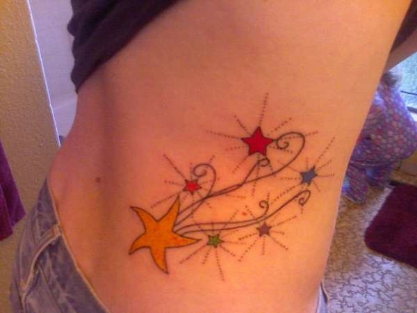 Colored Shooting Stars Tattoo On Side Rib
