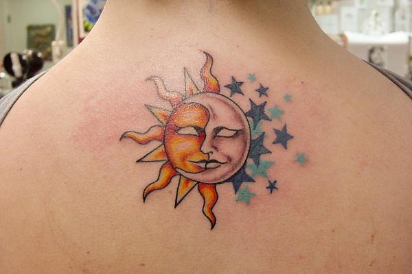 Colored Stars And Moon Sun Tattoo On Upper Back