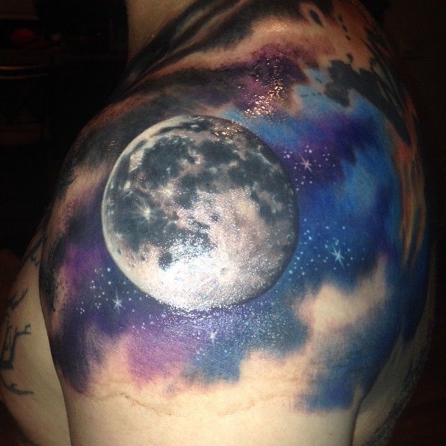 Colorful Moon Tattoo On Man Left Back Shoulder