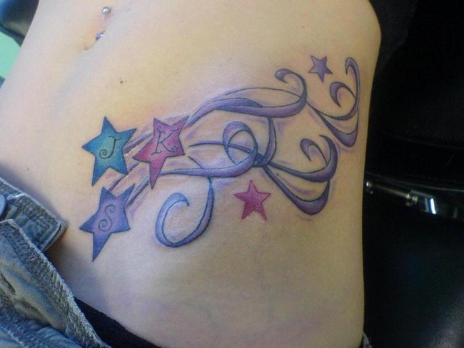 Colorful Shooting Stars Tattoo On Girl Left Hip