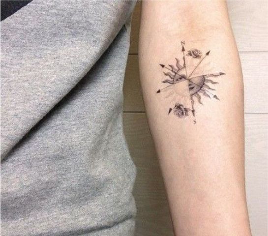 Compass And Small Sun Tattoo On Forearm
