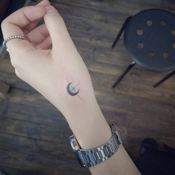 Crescent Moon Tattoo On Girl Left Hand