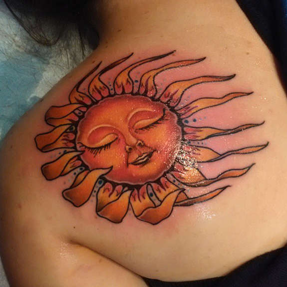 Cute Sleeping Sun Tattoo On Left Back Shoulder