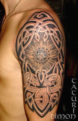 Dragons And Celtic Sun Tattoo On Man Left Shoulder