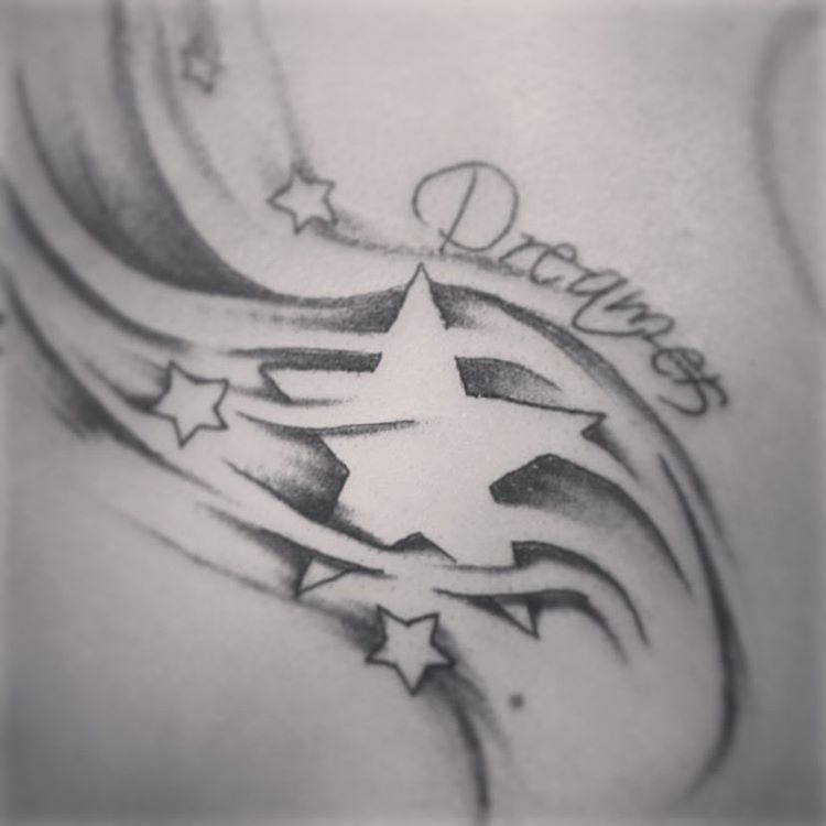 Dreamers And Shooting Stars Tattoo On Lower Back