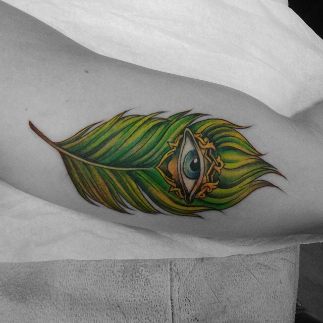 Eye In Green Feather Tattoo On Bicep