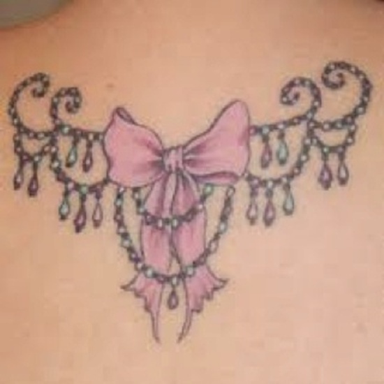 Feminine Bow Tattoo On Upper Back