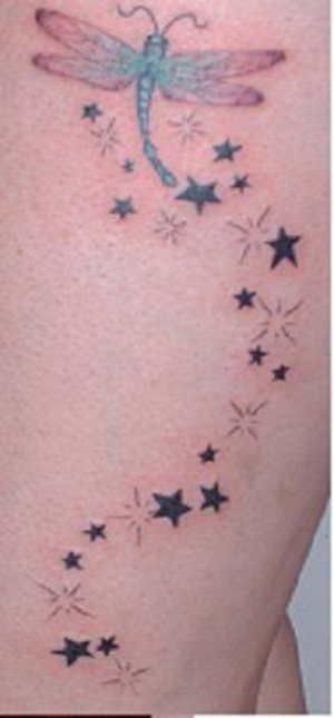 Flying Dragonfly And Shooting Stars Tattoo