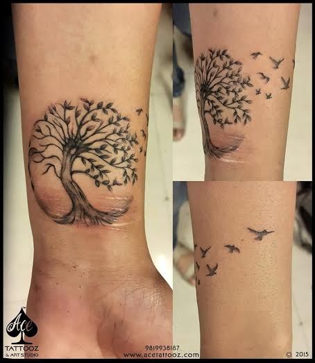 Flying birds And Tree Of Life Tattoo On Left Wrist