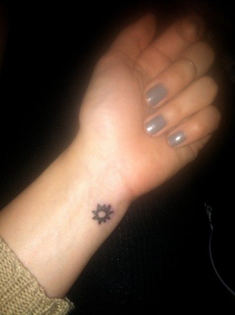 Girl Left Wrist Small Sun Tattoo Idea