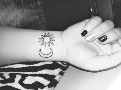 Girl With Moon And Sun Tattoo On Girl Right Wrist