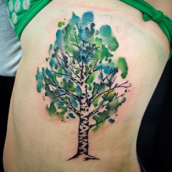 Green And Black Ink Birch Tree Tattoo On Girl Side Rib