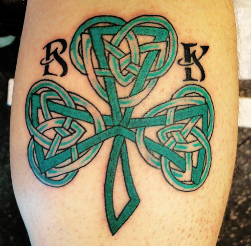 Green Ink Celtic Shamrock Tattoo On Back Leg