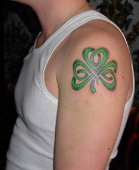 Green Ink Celtic Shamrock Tattoo On Left Shoulder