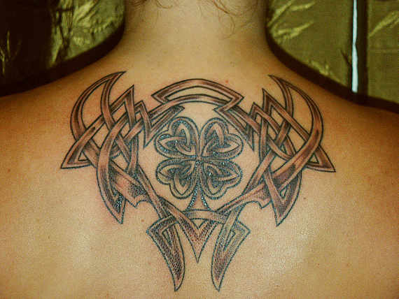 Grey And Black Celtic Shamrock Tattoo On Upper Back