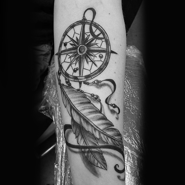Grey And Black Dreamcatcher With Compass Tattoo On Arm
