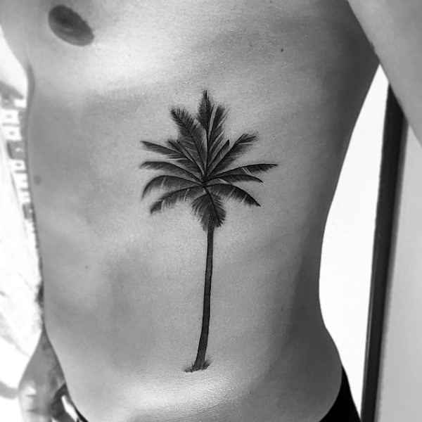 Grey And Black Ink Palm Tree Tattoo On Man Side Rib