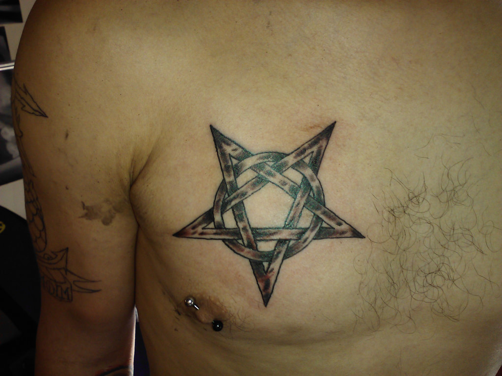 Grey And Black Pentagram Star Tattoo On Man Chest