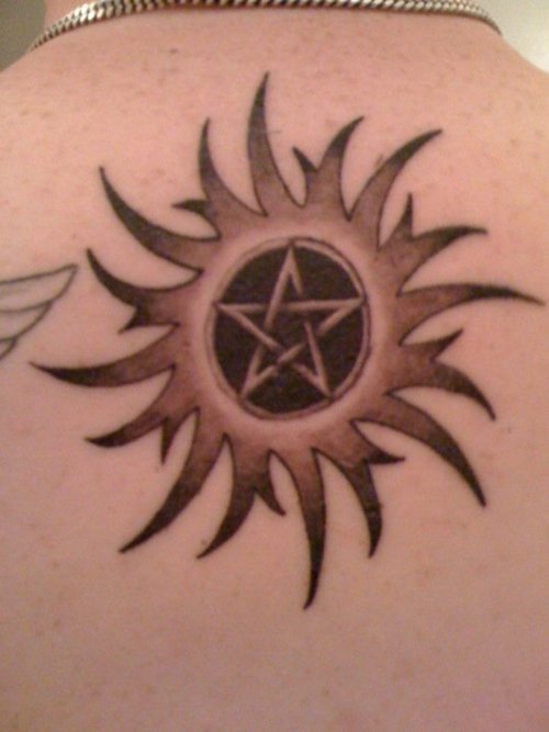 Grey And Black Pentagram Star Tattoo On Upper Back